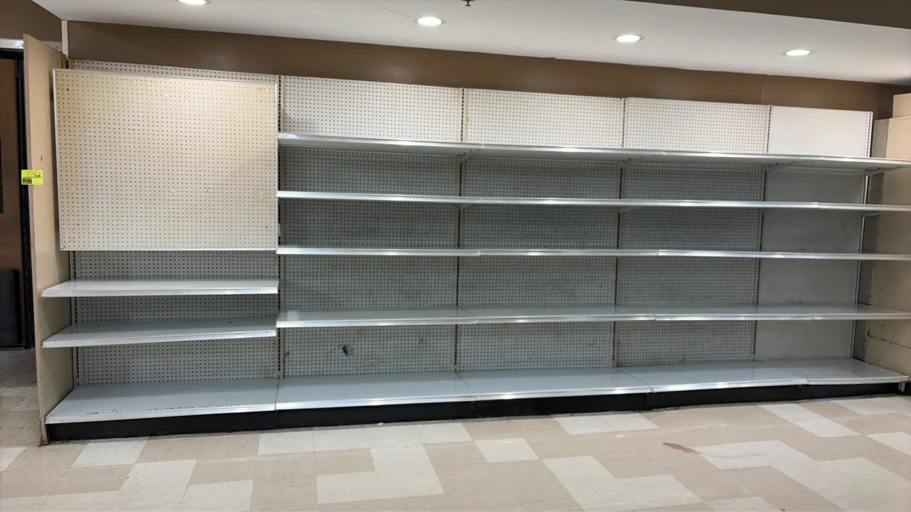 19'L of Madix wall shelving. 84"H uprights with 22"D base shelves. Features pegboard backing and adjustable shelves. Note: Sold by the foot.