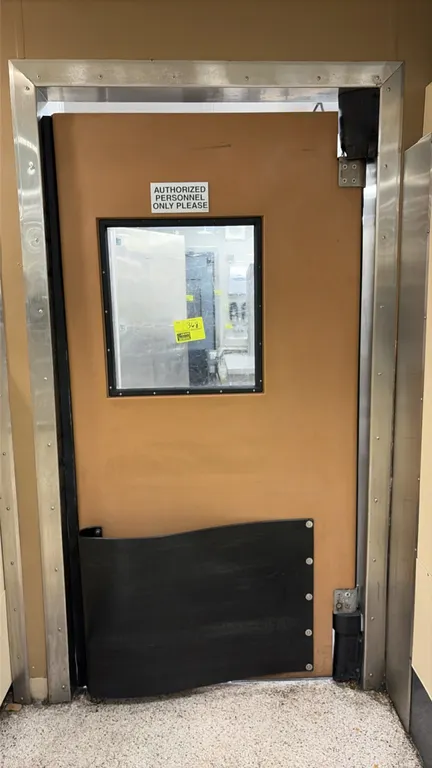 Poly swing door. Features a vision window, lower impact tear-drop bumper, hinges, and stainless steel frame. Dimensions: 40" x 80".