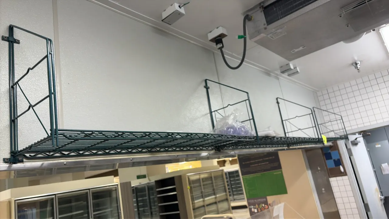 Green wire wall shelves. Features green wire construction and wall-mounting brackets. 4'L each. Contents not included.