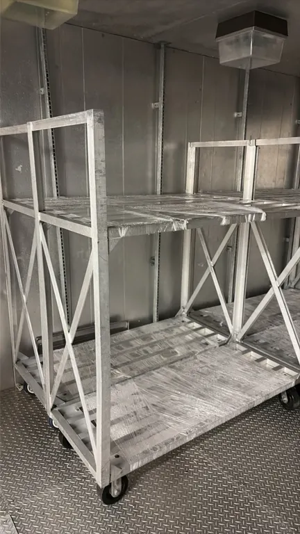 Aluminum 2-tier carts. Features 2-tier slatted aluminum shelving and cross-braced frame construction. 5'L. Mounted on casters.
