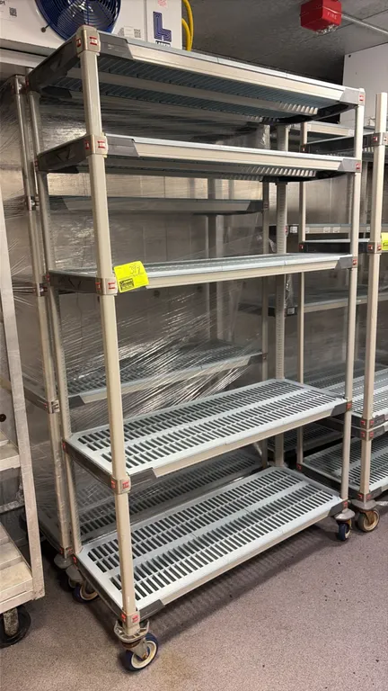 Metro MetroMax 5-tier mobile shelving carts. Features vented polymer grid shelves and polymer posts. 4'L. Mounted on swivel casters.