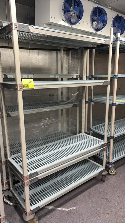 Metro MetroMax 5-tier mobile shelving carts. Features removable vented polymer shelf mats and adjustable shelf levels. 4'L. Mounted on swivel casters.