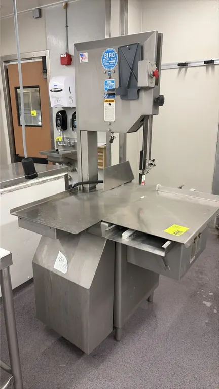 Biro 3334 commercial meat saw. Features stainless steel construction, sliding carriage table, thickness gauge plate, and blade guard. S/N: 53009. Elec