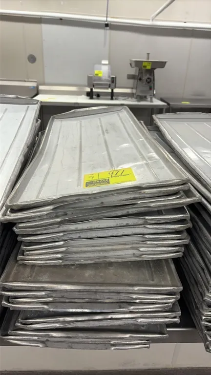 Aluminum meat platters. Features ribbed aluminum construction with raised edges. Dimensions: 30" x 12".