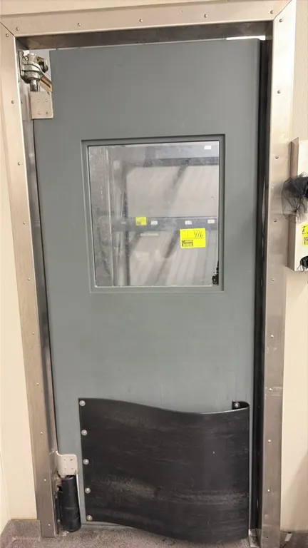 Polyethylene swing door. Features a viewing window and lower impact bumper plate. Dimensions: 34" x 80". Includes stainless steel frame and swing hing
