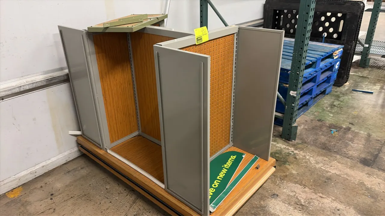 4-way retail display merchandiser. Features woodgrain pegboard panels, slotted upright standards, gray metal dividers, and woodgrain laminate base dec