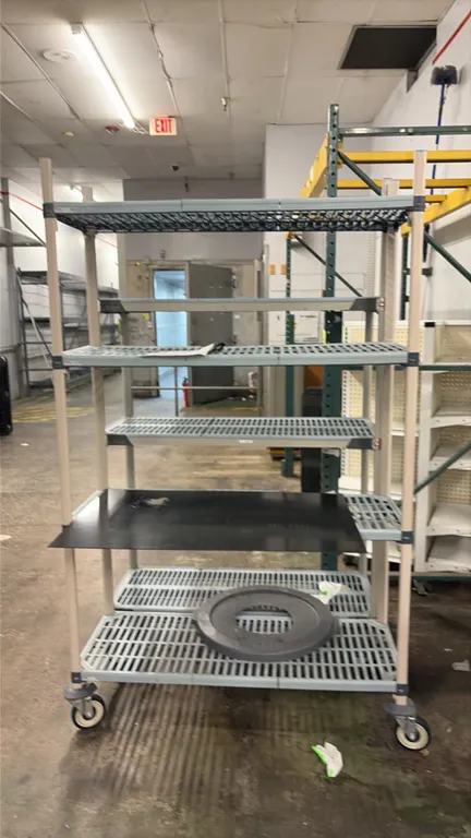 Metro MetroMax mobile shelving carts. Includes a 3-tier cart and a 4-tier cart. Features slotted polymer shelf mats. 4'L each. Mounted on swivel caste
