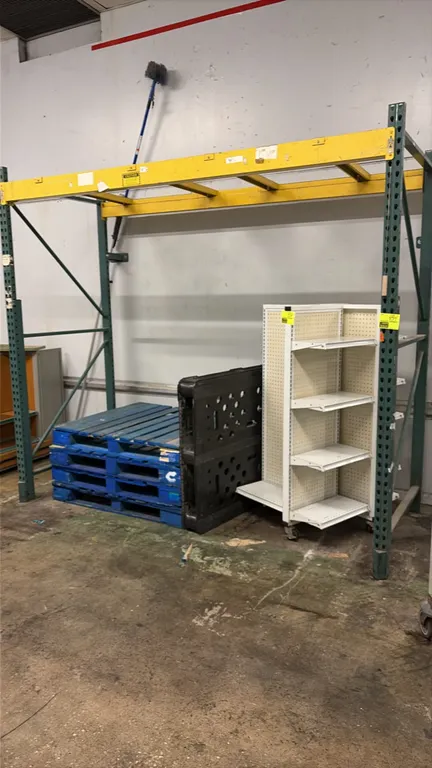 Warehouse pallet racking. Includes (2) green upright frames, (2) yellow crossbeams, and cross support bars. Dimensions: 8'L x 42"D x 8'H. Pallets, rol