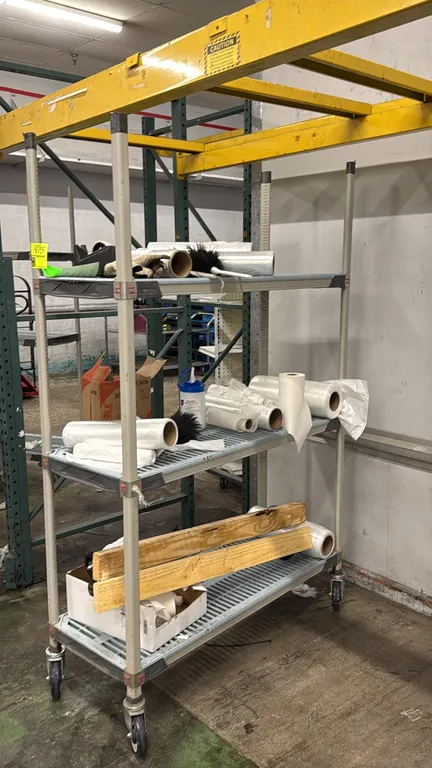 Metro MetroMax mobile shelving rack. Features (3) vented polymer grid shelves and composite posts. 48" x 18" x 74". Mounted on casters. Contents not i