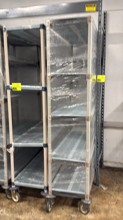 Metro MetroMax mobile shelving racks. Features adjustable vented polymer shelf mats and composite uprights. 48" x 18" x 80". Mounted on swivel casters
