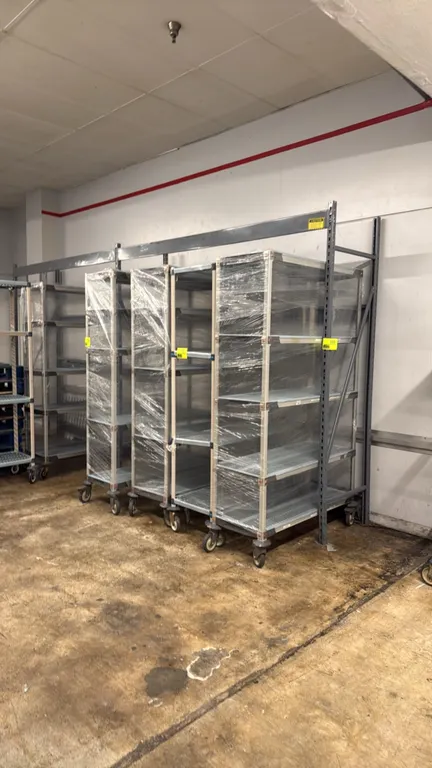 Madix light-duty warehouse racks. Features steel uprights and crossbeams. 8' x 26" x 8' each. Rolling carts, pallets, and contents not included.