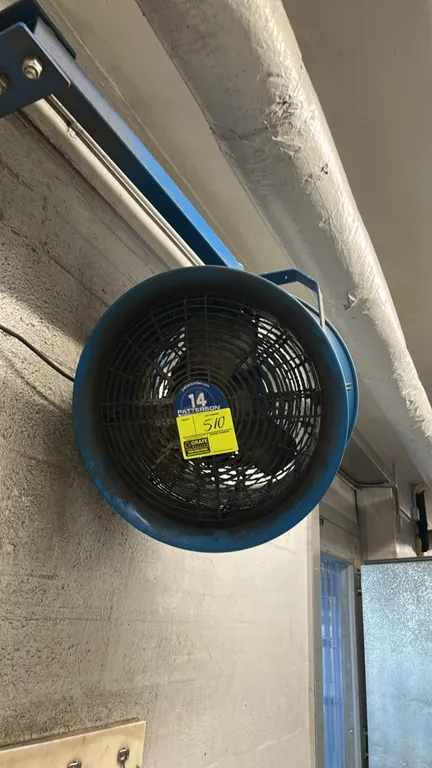 Patterson 14" high-velocity industrial fan. Features blue barrel housing with wire safety guards. 14" diameter. Includes wall mounting arm bracket and