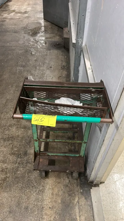 Metal stocking cart. Features slatted steel platform bed, upper wire mesh basket, and tubular push handle. 44"L. Mounted on casters. Contents not incl