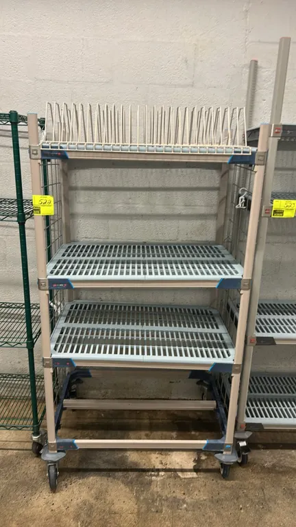 Metro MetroMax i mobile polymer multi-tier rack. Features (2) slotted polymer shelf mats, (1) top wire tray drying rack insert, and side wire grid pan