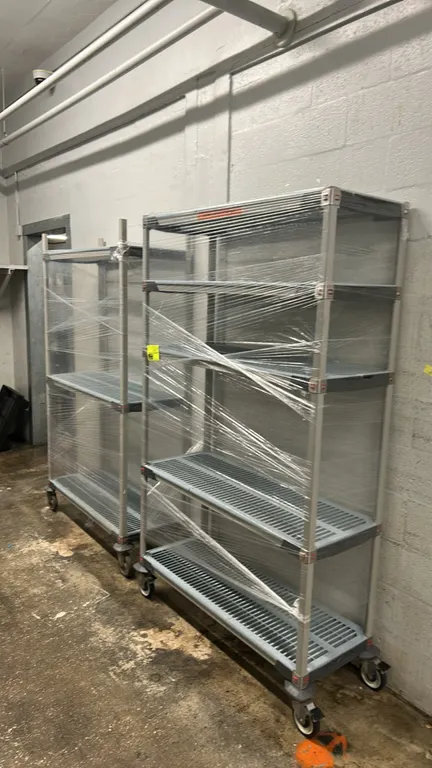 Metro MetroMax multi-tier portable shelving racks. Features removable polymer slotted shelf mats and composite frames. Includes (1) 5-tier rack and (1