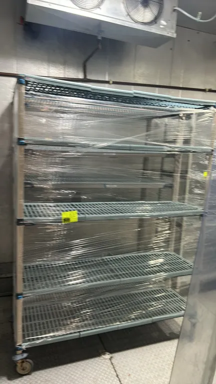 Metro MetroMax poly multi-tier portable racks. Features 5-tier open-grid polymer shelving. 60" x 18". Mounted on swivel casters.