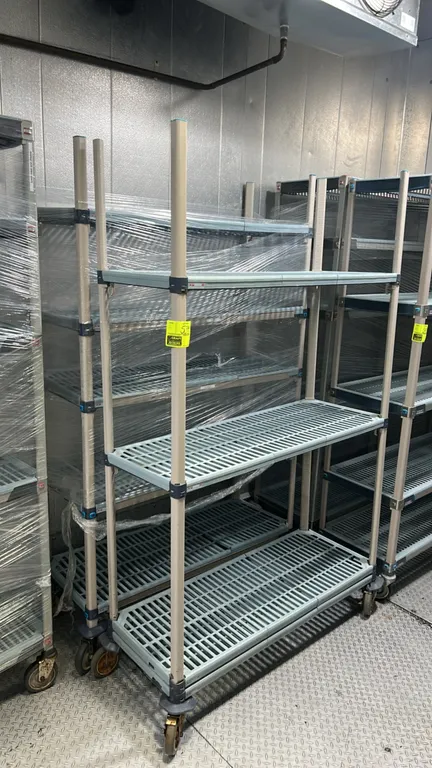 Metro MetroMax polymer multi-tier portable shelving racks. Features removable vented polymer shelf mats and adjustable tiers. 48"L x 18"W. Mounted on