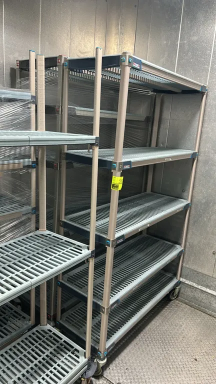 Metro MetroMax multi-tier portable shelving racks. Features polymer construction with vented removable shelf mats and 5 tiers of adjustable shelving.