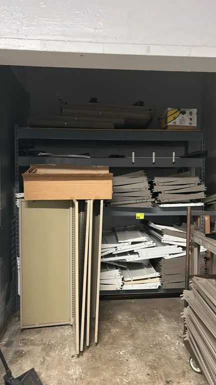 Metal multi-tier light-duty warehouse racking. Features steel upright frames, adjustable horizontal crossbeams, and multiple shelf tiers. Dimensions: