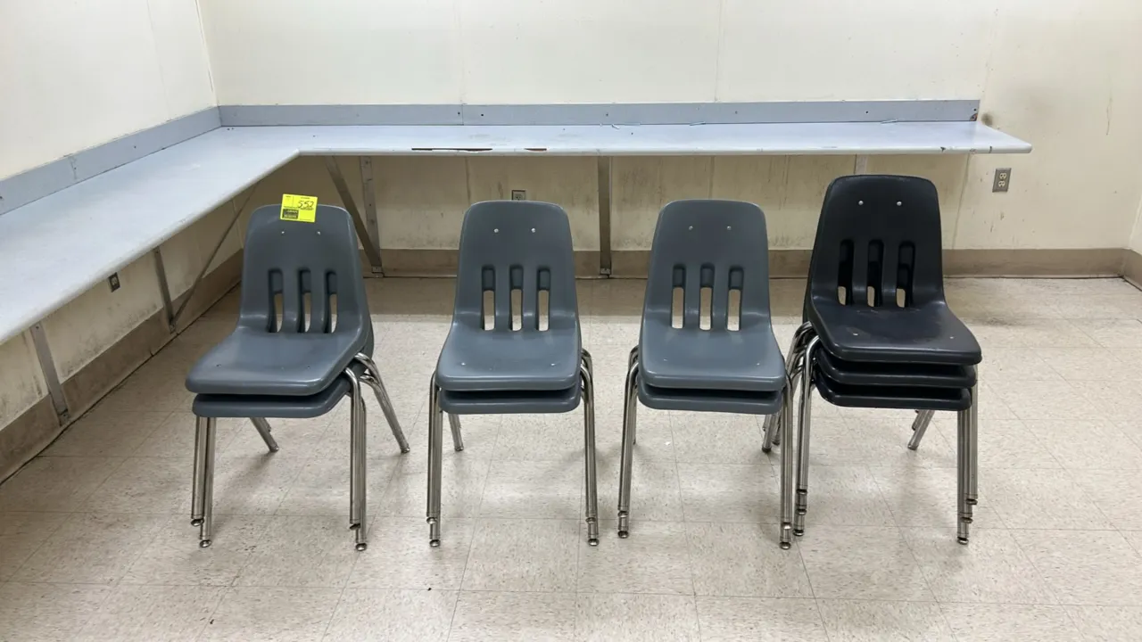 Molded poly stacking chairs. Features contoured plastic shell with lower back ventilation slots. Mounted on tubular metal legs with floor glides. Stac