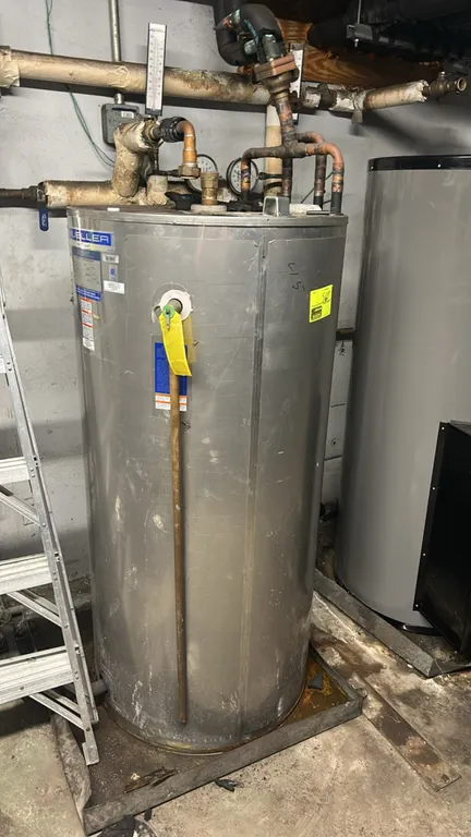 Mueller D2-120 Fre-Heater heat-recovery water heater. Features stainless steel construction, 119-gallon tank capacity, and dual refrigeration circuits