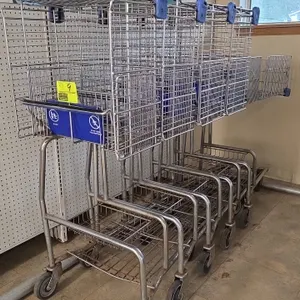Over-the-counter wire shopping carts. Features nesting wire construction, upper basket with blue folding child seat, blue plastic corner bumpers, lowe