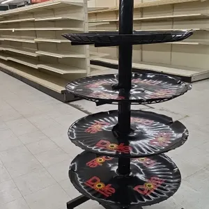 Dole portable 5-tier banana display rack. Features circular tiered display levels with Dole branding and black metal construction. Mounted on a mobile