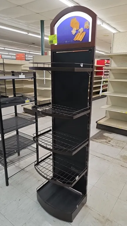 Metal 5-tier merchandiser display rack. Features textured hammered-finish metal frame, 4 wire basket shelves, solid bottom shelf, and arched top graph