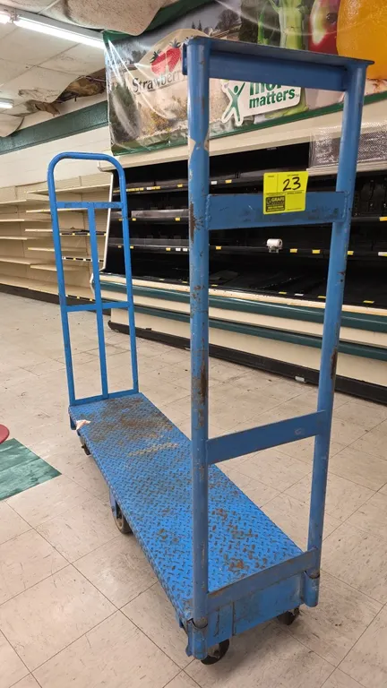 Metal 6-wheel U-boat platform stocking cart. Features a blue diamond-tread steel deck and (2) removable tall tubular end handles. 60"L. Mounted on (6)