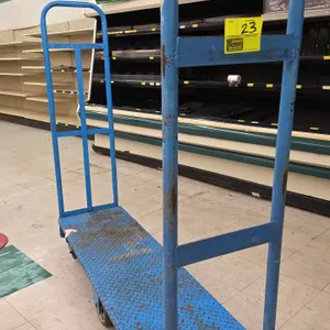 Metal 6-wheel U-boat platform stocking cart. Features a blue diamond-tread steel deck and (2) removable tall tubular end handles. 60"L. Mounted on (6)
