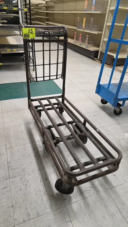 Tubular steel stock cart. Features an upright handle with an upper wire basket and tubular slatted platform deck. 39"L. Mounted on a 6-wheel configura