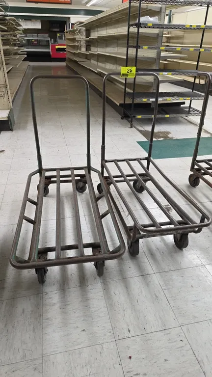 Tubular metal stock carts. Features open slatted steel decks and loop push handles. Assorted sizes. Mounted on casters.