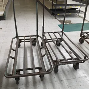 Tubular metal stock carts. Features open slatted steel decks and loop push handles. Assorted sizes. Mounted on casters.