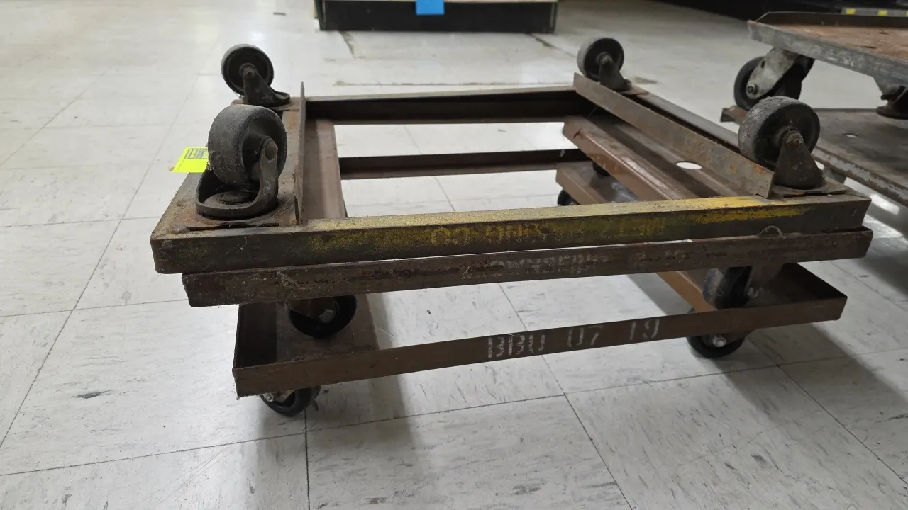 Steel 4-wheel material handling dollies. Features open-frame steel construction. Mounted on swivel casters. 23" x 27".