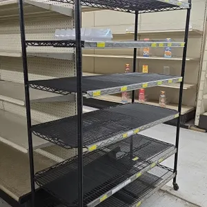 Portable 6-tier wire shelving unit. Features black wire construction, 6 adjustable shelves with shelf label channels, and shelf liners. 48"L x 21"W x 