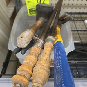 Assorted hand tools and sharpening steels. Includes (2) honing steels with turned wood handles and hanging rings, (1) mallet with wood handle, (1) Reg