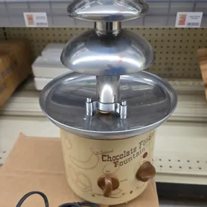 Nostalgia Electrics CFF-884 Old Fashioned chocolate fondue fountain. Features a 3-tier stainless steel tower, stainless steel reservoir basin, and dua