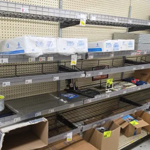 Wire shelves with galvanized wall brackets. Features 48"L wire display shelves with shelf-edge label holders and galvanized slotted wall upright stand