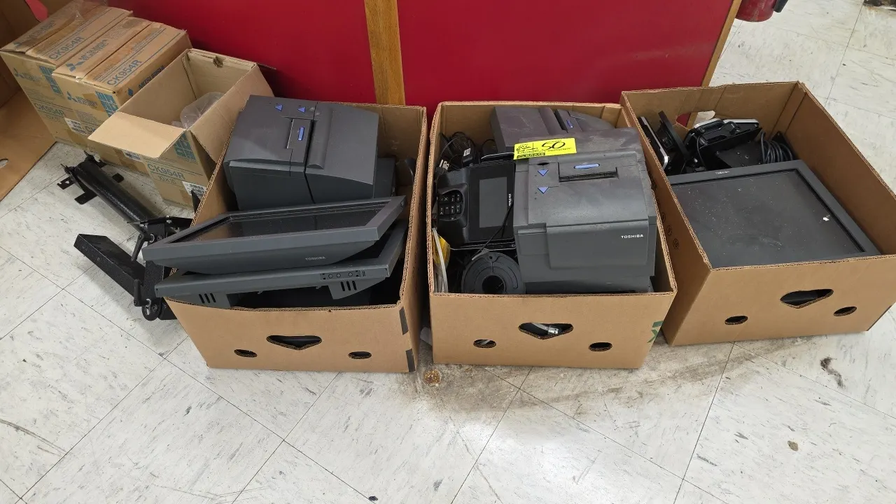 Assorted point-of-sale equipment. Includes Toshiba display monitors, receipt printers, Verifone payment terminals, mounting brackets, cables, and medi