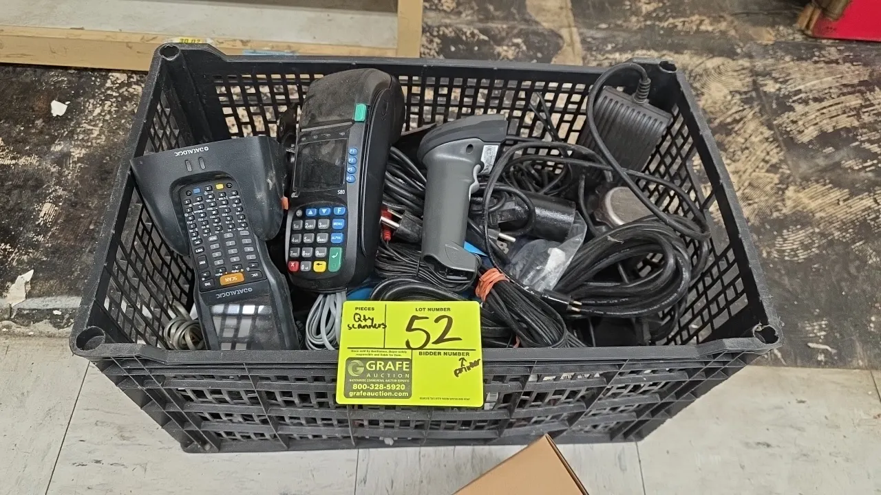 Assorted point-of-sale equipment. Includes PAX S80 payment terminal, Datalogic mobile computer scanner with cradle, handheld barcode scanner, pole mou
