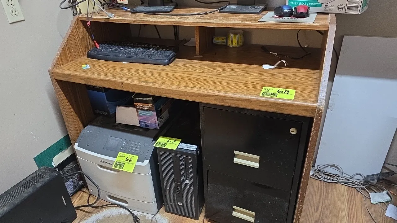 Laminated wood desk with 2-drawer file cabinet. Features an upper shelf and woodgrain laminate finish. Includes a black metal 2-drawer file cabinet. 4