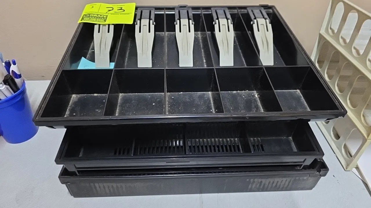 Cash drawer till inserts. Includes (3) black plastic cash trays featuring bill compartments with spring-loaded clips, coin sections, and slotted base