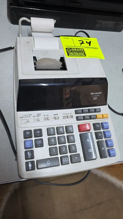 Sharp EL-1197PIII 12-digit printing calculator. Features top-loading paper roll holder and standard accounting keys. S/N: 6D01800Y. Electrical: 120V,