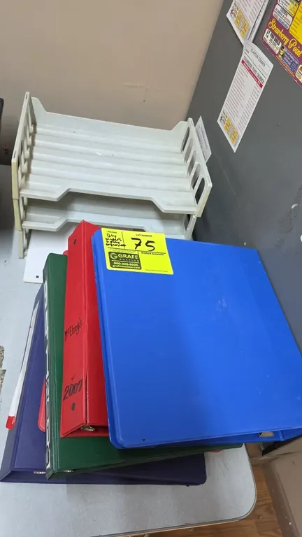 Assorted office supplies lot. Includes 3-ring binders in assorted colors and sizes, plastic stacking desktop paper organizer trays, and clear sheet pr