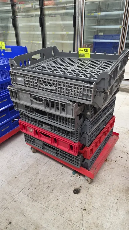 Poly stackable bread trays. Features red and gray molded plastic construction with perforated grid bottoms and integrated side handles. Includes 4-whe