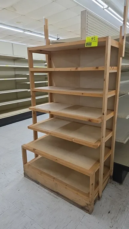 Wood endcap merchandise display rack. Features 6-tier tiered wood shelving with graduated shelf depths and wood backing. 36" x 72.5"H. Gondola shelvin