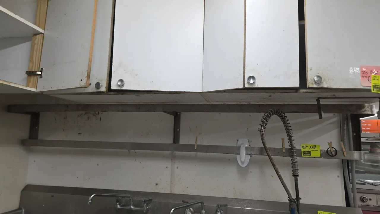 Stainless steel 2-tier rack. Features dual flat bar rails and integrated mounting brackets. 8'L. Wall-mounted design. Sink, faucet, upper cabinets, an
