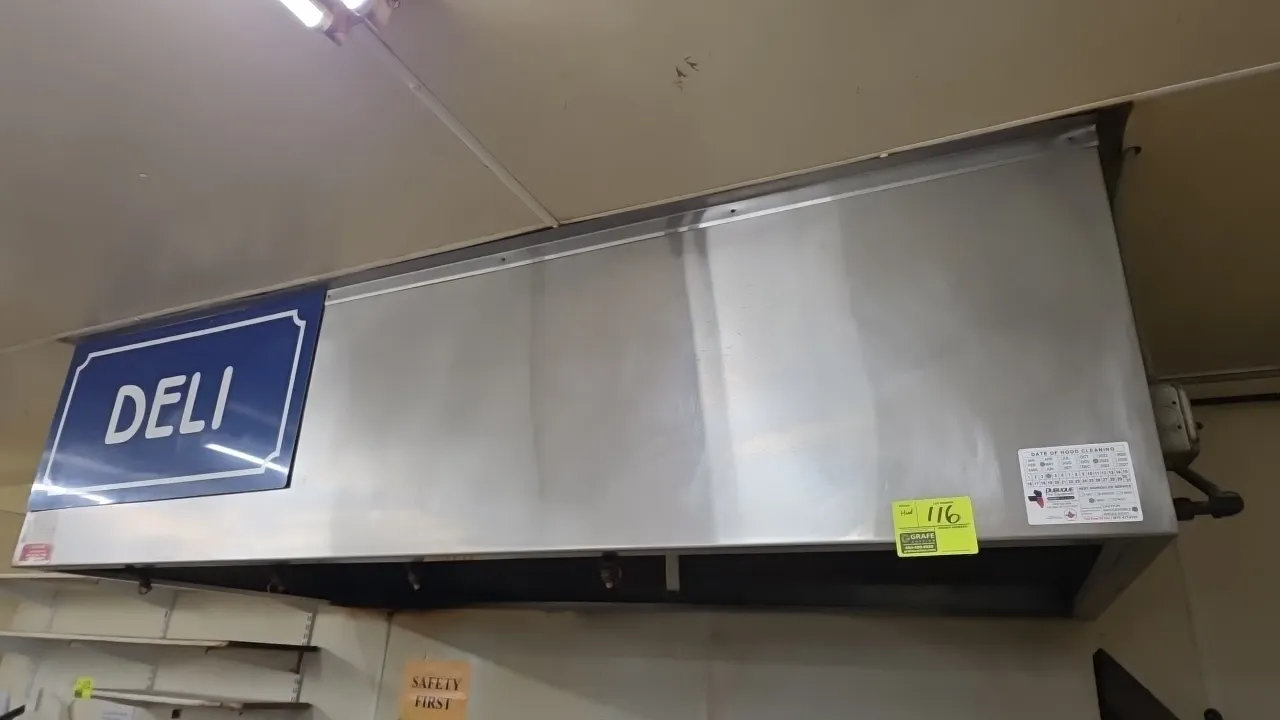 Stainless steel exhaust hood with fire suppression system. Features Sentinel Aqua-Blue wet chemical suppression system with piping and nozzles, baffle