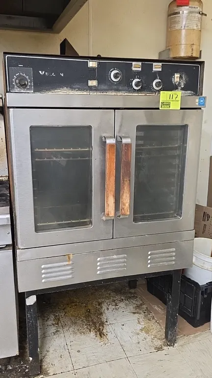 Vulcan 2-door electric oven. Features double glass doors with wood handles, interior wire racks, and top analog control panel. Mounted on a metal equi