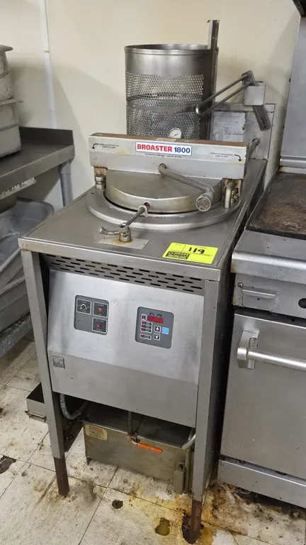 Broaster 1800 commercial pressure fryer. Stainless steel construction. Features digital controls, locking lid mechanism, built-in oil filtration pan,